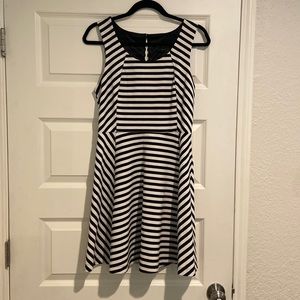 Express- medium, black and white fit and flare dress with round neck.